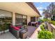 Inviting covered patio with comfortable seating and sliding glass doors at 2857 San Lago Ct, Las Vegas, NV 89121