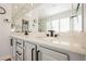 Bathroom with dual sinks, quartz counters, modern fixtures, and a glass shower at 3042 Soft Horizon Way, Las Vegas, NV 89135