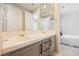 Bathroom featuring double sinks with white tile countertop, gray cabinets, and gold fixtures at 3042 Soft Horizon Way, Las Vegas, NV 89135