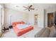 Cozy bedroom with a large bed, ceiling fan, and access to an en-suite bathroom at 3042 Soft Horizon Way, Las Vegas, NV 89135