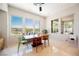 Bright dining area featuring natural light, stylish furnishings, and backyard views at 3042 Soft Horizon Way, Las Vegas, NV 89135
