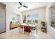 Sunny dining room with natural light, modern furniture, and pleasant views at 3042 Soft Horizon Way, Las Vegas, NV 89135