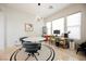 Bright dining room features a modern light fixture, round table, and large windows at 3042 Soft Horizon Way, Las Vegas, NV 89135