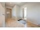 Entryway with tiled floors, white walls, recessed lights, and glass paneled front door at 3042 Soft Horizon Way, Las Vegas, NV 89135