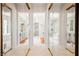 Mirrored hallway leading to elegant bathrooms with dual vanities and glass showers at 3042 Soft Horizon Way, Las Vegas, NV 89135