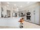 Bright kitchen features stainless steel appliances, gray cabinets, granite countertops and a center island with seating at 3042 Soft Horizon Way, Las Vegas, NV 89135