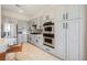 Modern kitchen with stainless appliances, white countertops, and custom cabinets at 3042 Soft Horizon Way, Las Vegas, NV 89135
