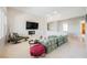 Bright open living room with plush sofa, fireplace, and view to the next room at 3042 Soft Horizon Way, Las Vegas, NV 89135