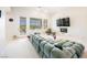 Bright living room with plush seating, balcony, and views of the backyard at 3042 Soft Horizon Way, Las Vegas, NV 89135