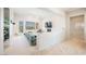 Open living room with a plush sofa, balcony access, and views of the pool at 3042 Soft Horizon Way, Las Vegas, NV 89135