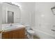 Bathroom featuring a single sink vanity, toilet and tub shower combo at 3580 S Shawnee Ave, Pahrump, NV 89048