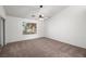 Bedroom featuring neutral carpeting, a ceiling fan, and a bright window at 3580 S Shawnee Ave, Pahrump, NV 89048