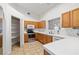 Classic kitchen with wood cabinets, white tile countertops and stainless steel appliances at 3580 S Shawnee Ave, Pahrump, NV 89048