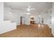 Spacious living room featuring hardwood floors, modern ceiling fans, and an open layout at 3580 S Shawnee Ave, Pahrump, NV 89048