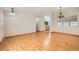 Open-concept living area with hardwood floors and seamless access to the kitchen at 3640 Snowy Pines St, Las Vegas, NV 89147