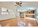 Hardwood floors, open-concept layout with views to kitchen at 3640 Snowy Pines St, Las Vegas, NV 89147