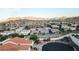 Elevated view of a residential community nestled in the desert, offering mountain views and modern Southwestern architecture at 390 Montego Ln, Boulder City, NV 89005