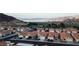 Lakefront community boasts charming single-Gathering homes and lush landscaping with a breathtaking mountain backdrop at 390 Montego Ln, Boulder City, NV 89005