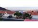 Lakefront community with well-maintained homes with tile roofs and beautiful landscaping. Scenic water and mountain views at 390 Montego Ln, Boulder City, NV 89005