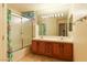 Bathroom featuring double sinks, tub/shower, and natural light at 390 Montego Ln, Boulder City, NV 89005