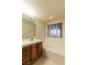 Bathroom with a soaking tub and a single sink vanity at 390 Montego Ln, Boulder City, NV 89005
