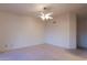 Bedroom features ceiling fan, window, and a door to a walk-in closet at 390 Montego Ln, Boulder City, NV 89005