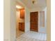 Entryway with tiled floor, wooden door, and wood storage cabinets at 390 Montego Ln, Boulder City, NV 89005