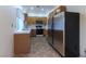 An eat-in kitchen features stainless-steel refrigerator and wood cabinets at 390 Montego Ln, Boulder City, NV 89005