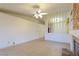 Spacious living room has tile flooring, ceiling fan and fireplace at 390 Montego Ln, Boulder City, NV 89005