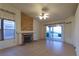 Open-concept living room boasts a stone fireplace and a view of the outdoor patio at 390 Montego Ln, Boulder City, NV 89005