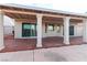Covered patio with support pillars and tile flooring, creating an ideal outdoor living space for relaxation at 390 Montego Ln, Boulder City, NV 89005