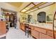 Bright bathroom with double sinks, a vanity area, walk-in closet and honey-toned cabinetry at 3987 Saddlewood Ct, Las Vegas, NV 89121