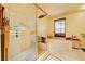 This bathroom features a glass enclosed shower and separate soaking tub plus neutral color tile at 3987 Saddlewood Ct, Las Vegas, NV 89121