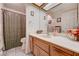 Well-lit bathroom featuring a single sink vanity with a shower-tub combo and tile flooring at 3987 Saddlewood Ct, Las Vegas, NV 89121