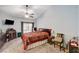Cozy bedroom with carpet, ceiling fan, large window and vintage style decor at 3987 Saddlewood Ct, Las Vegas, NV 89121
