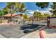 Gated community entrance with mature trees and manicured landscaping, offering privacy and security at 3987 Saddlewood Ct, Las Vegas, NV 89121