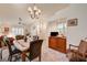 Bright dining area with elegant chandelier and seating for four at 3987 Saddlewood Ct, Las Vegas, NV 89121