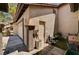 Exterior detail of a home featuring a side entry door, attached garage and tiled walkway at 3987 Saddlewood Ct, Las Vegas, NV 89121