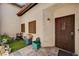 Covered front porch with security door featuring slate tile flooring and outdoor decor at 3987 Saddlewood Ct, Las Vegas, NV 89121