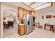 Open kitchen featuring a stainless steel refrigerator and oven adjacent to a dining and sitting area at 3987 Saddlewood Ct, Las Vegas, NV 89121