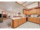Open kitchen design with breakfast bar that overlooks the living room at 3987 Saddlewood Ct, Las Vegas, NV 89121