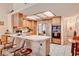 Well-lit kitchen with stainless steel appliances and breakfast bar at 3987 Saddlewood Ct, Las Vegas, NV 89121