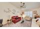 Bright living room featuring vaulted ceilings, plush carpet, and comfortable seating arrangements at 3987 Saddlewood Ct, Las Vegas, NV 89121