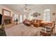 Spacious living room features a brick fireplace and ample seating at 3987 Saddlewood Ct, Las Vegas, NV 89121