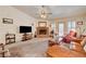 Comfortable living room with a fireplace, perfect for relaxing at 3987 Saddlewood Ct, Las Vegas, NV 89121