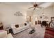Spacious living room with plush carpeting, vaulted ceilings, and an open flow to the dining area at 3987 Saddlewood Ct, Las Vegas, NV 89121