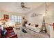 Open living room boasts vaulted ceilings, plush carpeting, and ample natural light from the shuttered windows at 3987 Saddlewood Ct, Las Vegas, NV 89121