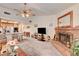 Cozy living room with brick fireplace and open access to the kitchen at 3987 Saddlewood Ct, Las Vegas, NV 89121