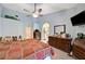 This airy main bedroom has lots of natural light, neutral walls, ensuite bath access and a ceiling fan at 3987 Saddlewood Ct, Las Vegas, NV 89121