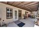 Rear patio featuring cover, tile flooring, a door to the home, and exterior storage space at 3987 Saddlewood Ct, Las Vegas, NV 89121